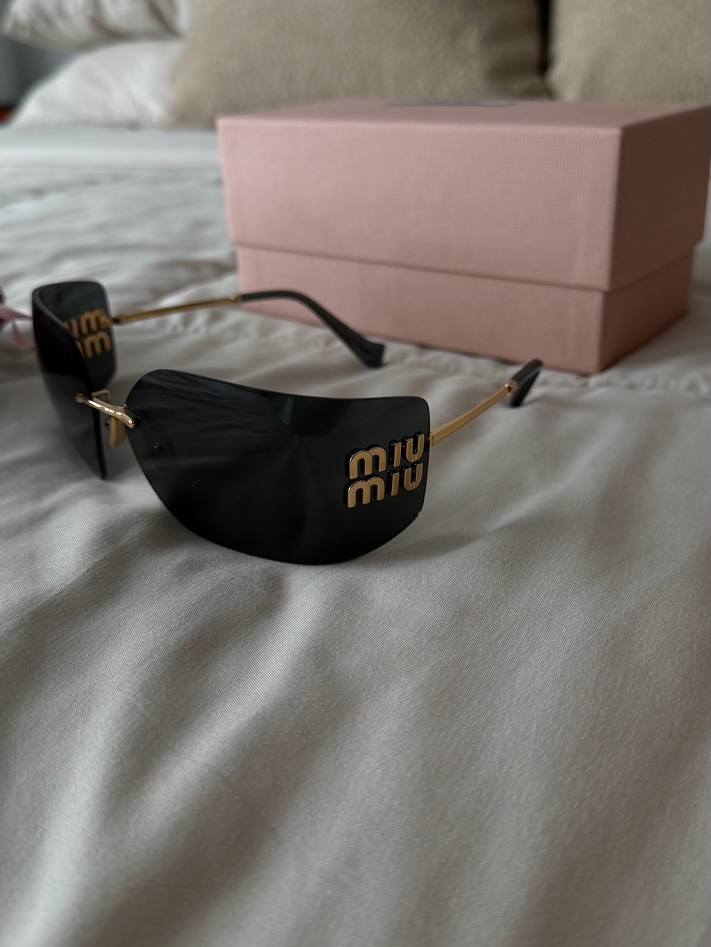 Miu Miu Black and Gold Rimless Logo Shield Sunglasses